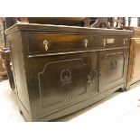 A 1920's oak sideboard and a Continental stained pine side cabinet