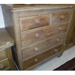 A 19th Century pine chest of two short over three long drawers raised on turned feet