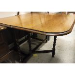 An early 20th Century oak rounded rectangular gate-leg drop-leaf dining table on barley-twist