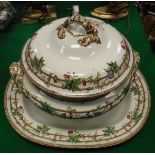 A Copeland lidded tureen and a serving plate decorated with armorial amongst flowers on vine on