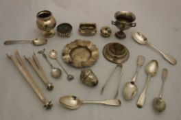 A box containing assorted silver items to include various spoons, pin cushion, etc,