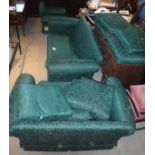 A large three piece suite in green foliate upholstery,