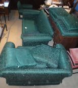 A large three piece suite in green foliate upholstery,