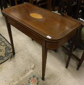 A 19th Century mahogany and inlaid rounded rectangular fold-over card table on square tapered legs