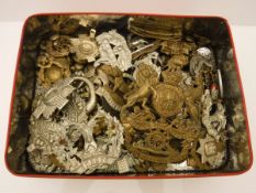 A box of various military and other cap badges, buttons etc, together with a box of various coins,