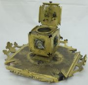 A late 19th Century Arts and Crafts aesthetic style gilt bronze inkwell with applied carved stone