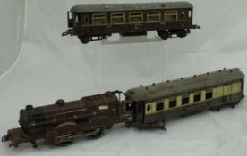 A collection of Hornby 0 gauge railwayana including Royal Scot 1-0-0 loco and tender in LMS livery,