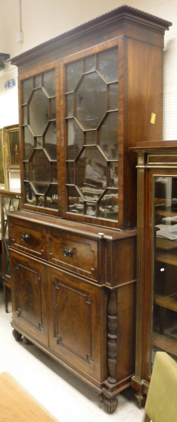 A late Regency mahogany secretaire bookcase cabinet in the Gillows manner,