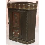 A circa 1900 stained beech corner cupboard of small proportions with carved and painted decoration