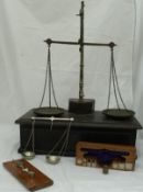 A Victorian oak and brass set of scales with drawer containing various weights,