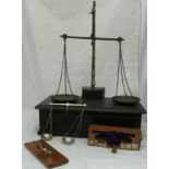 A Victorian oak and brass set of scales with drawer containing various weights,