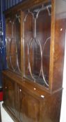 A 19th Century mahogany and inlaid bookcase cabinet,