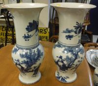 A matched pair of blue and white Chinese baluster shaped vases with flared rims,