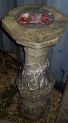 A reconstituted stone garden sundial on a faceted baluster base,