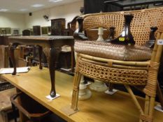 A pair of turned onyx table lamps, a coffee table, footstool, cane chair,