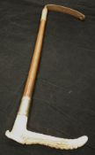 A lady's riding crop with antler handle and plated ferrule with plaited leather shaft