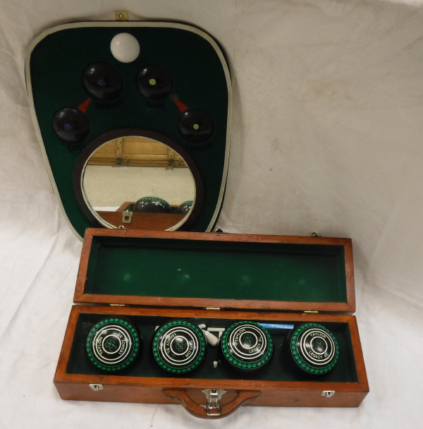 A set of four Taylor Legacy bowling bowls in hardwood case,