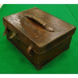 A vintage leather fishing holdall with green baize-lined compartments