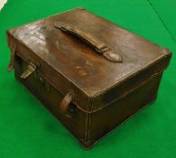 A vintage leather fishing holdall with green baize-lined compartments