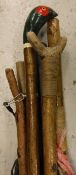 A collection of assorted wading staffs and walking sticks,