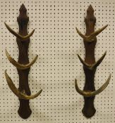 A two section oak and antler whip rack,