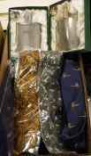 A box of various sporting themed ties, together with two hip flask sets, three Acme Reed horns,