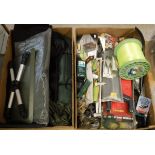 Two boxes containing a large selection of miscellaneous fishing tackle to include rod rests, hooks,