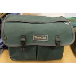 A Wychwood canvas fly fisher's bag containing an assortment of Hardy fly lines and three leather