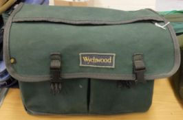 A Wychwood canvas fly fisher's bag containing an assortment of Hardy fly lines and three leather