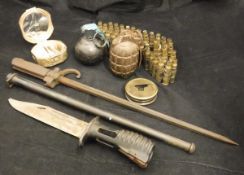 A collection of militaria to include a pineapple grenade stamped "C.A.