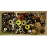 A box containing assorted glass eyes of varying colours and sizes