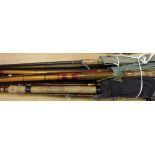 A collection of assorted fishing rods to include examples by Daiwa, ABU,