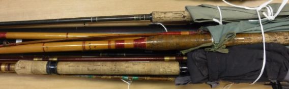 A collection of assorted fishing rods to include examples by Daiwa, ABU,
