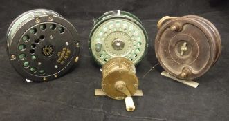 A Daiwa Model 812 salmon fly reel, an Olympic trout fly reel,