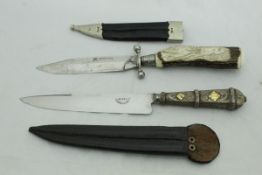 A Gebrüder Rauh steel-bladed knife with carved antler handle depicting running deer,