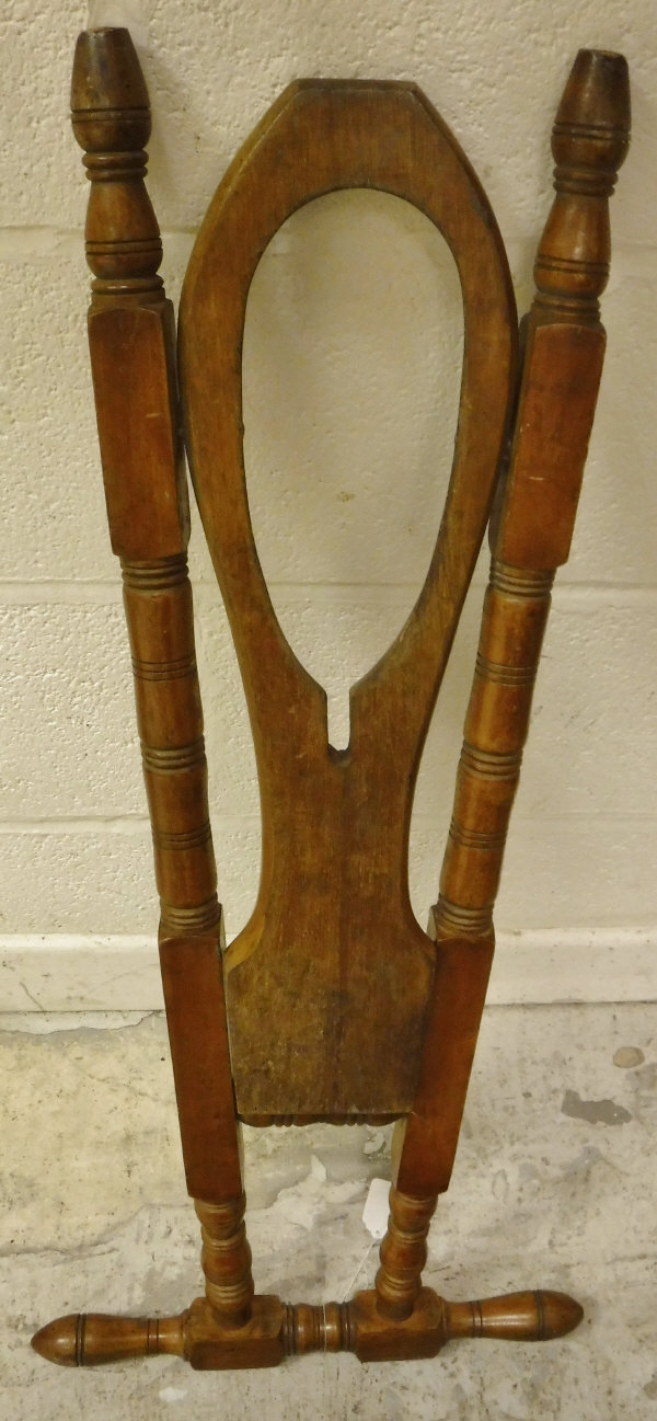 A beech free-standing boot jack