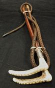 Two antler handled riding crops, one with silver ferrule, the other inscribed "Anne Lamont",