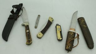 A bag containing five various knives, two Puma knives, one with antler handle and leather case,