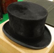 A black silk top hat by Lock & Co.