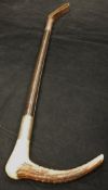 An antler handled riding crop with steel ferrule and leather shaft