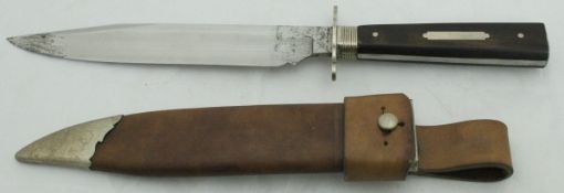 A large wooden-handled hunting knife in leather sheath/scabbard CONDITION REPORTS