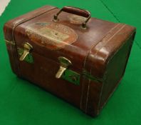 A vintage leather ladies vanity case opening to reveal mirror and drawer,