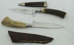 An Rostfrei antler-handled knife in leather sheath,