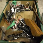 A box of assorted tack, etc, to include various bits, boot jack,