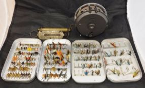 An assorted collection of fishing tackle to include two large and one small Wheatley alloy fly