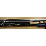 A collection of four assorted fibreglass fishing rods to include a Shakespeare float rod,