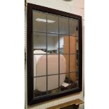 A rectangular mirror with an iron frame,