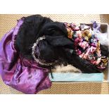 A box containing a velvet and black lace dress, a glass bead decorated hair piece,