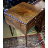 An early Victorian mahogany Pembroke work table the rounded rectangular drop leaf top over a drawer