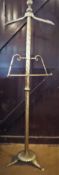 A brass valet stand